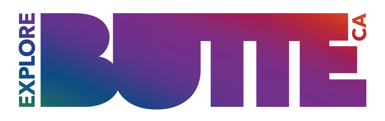 The Explore Butte County logo with a purple, blue, and pink gradient